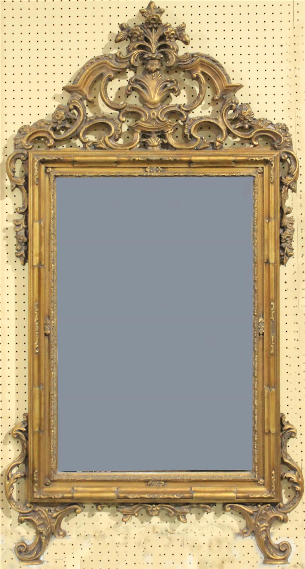 Appraisal: FRENCH LOUIS XV STYLE MIRROR having a carved and pierced