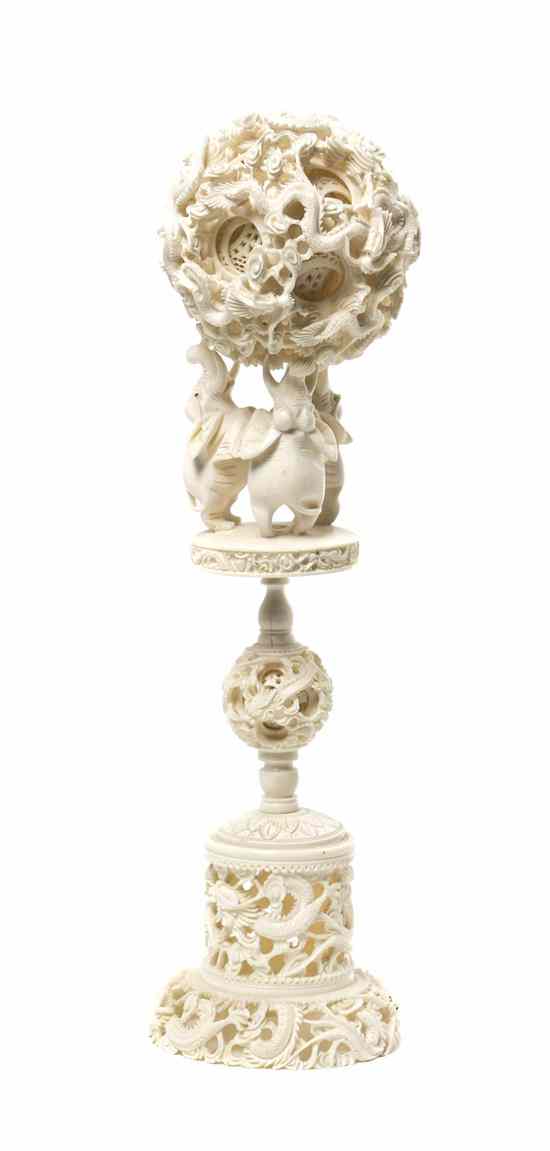 Appraisal: A Chinese Carved Ivory Puzzle Ball on Stand the pierce