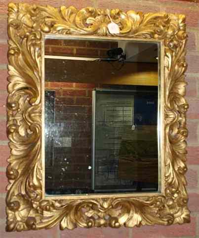 Appraisal: AN ANTIQUE FLORENTINE CARVED GILTWOOD PICTURE FRAME the border with