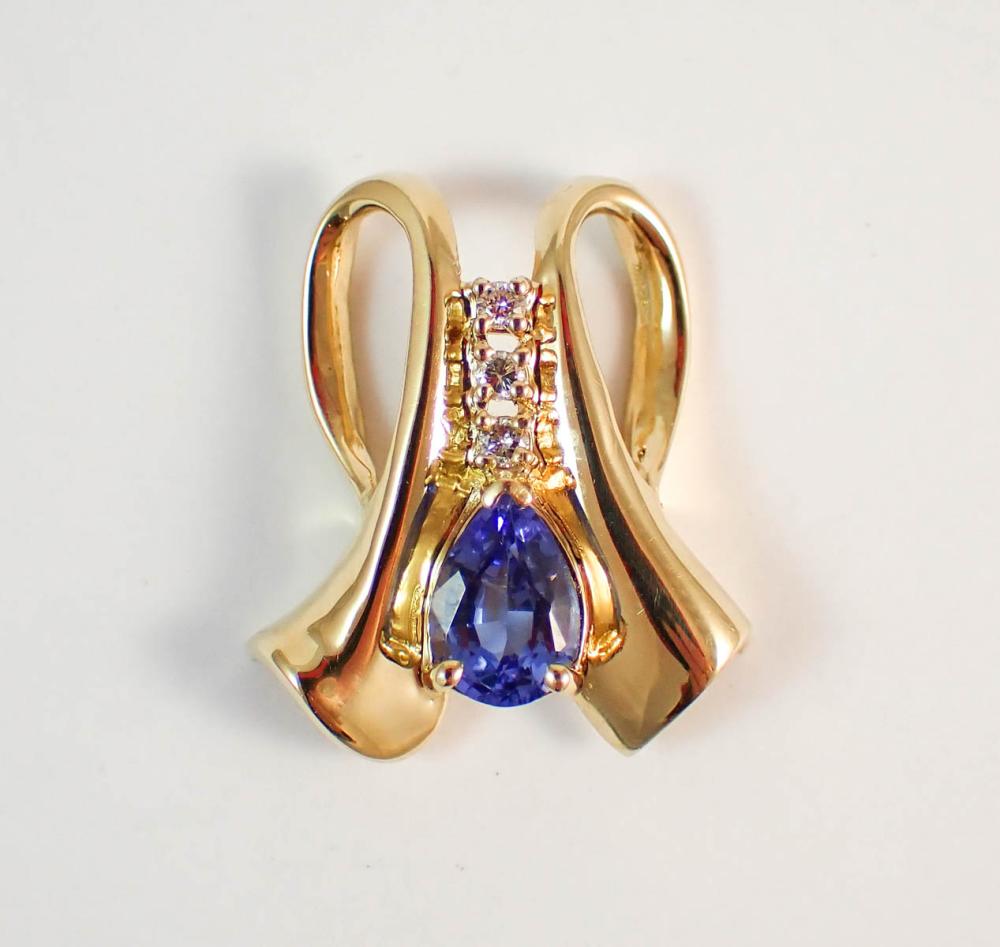 Appraisal: TANZANITE DIAMOND AND FOURTEEN KARAT GOLD SLIDE PENDANT with three