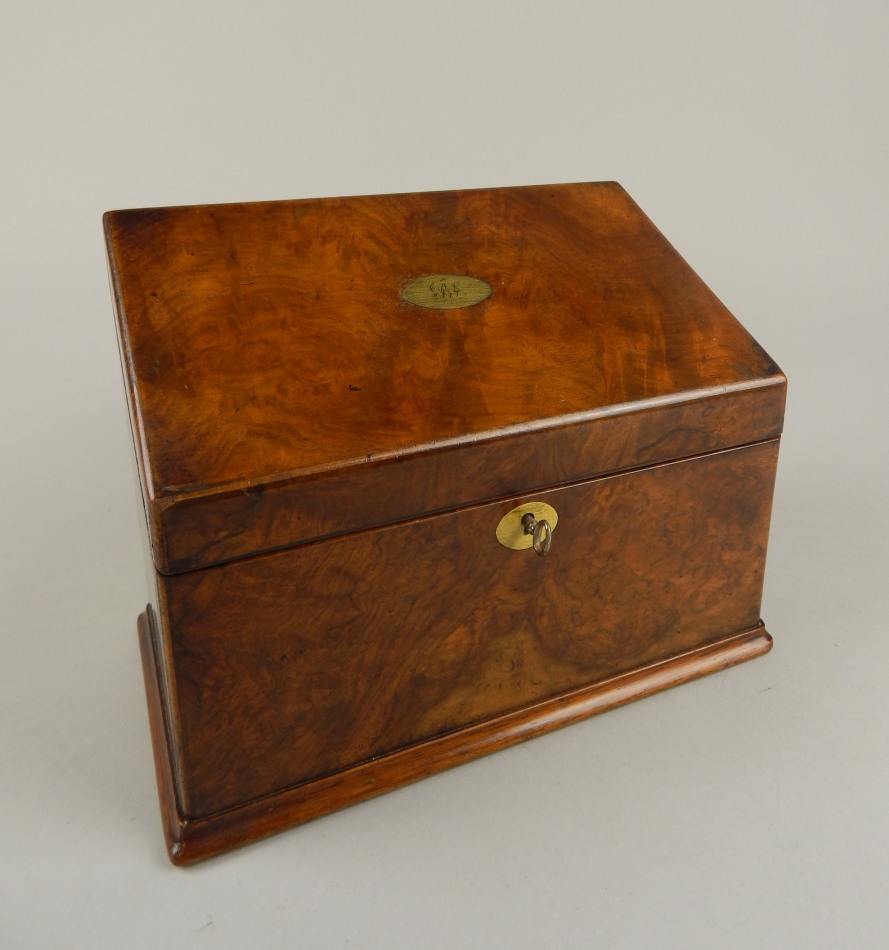 Appraisal: A Victorian walnut stationery box the sloping hinged lid opening