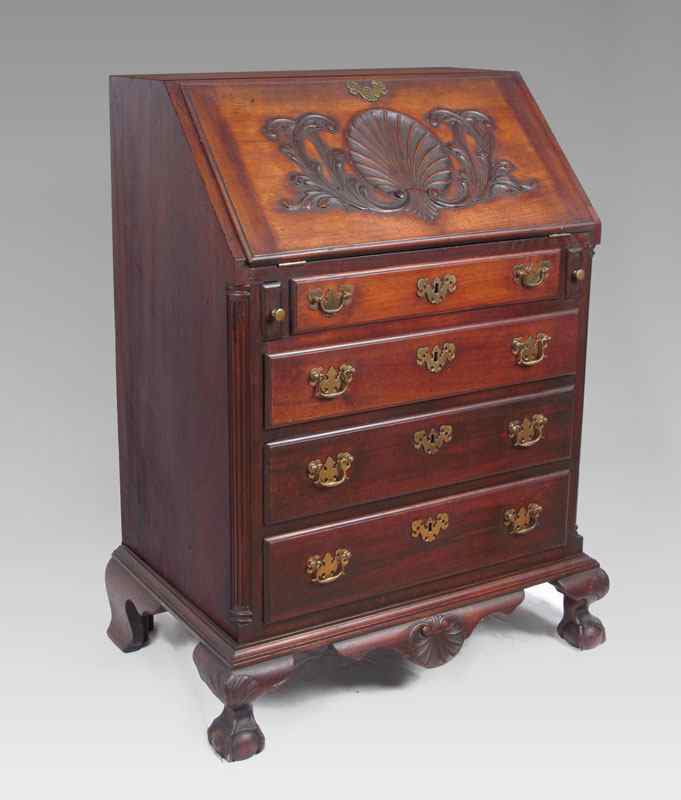 Appraisal: DIMINUTIVE BUREAU DESK Early th Century carved mahogany slant front