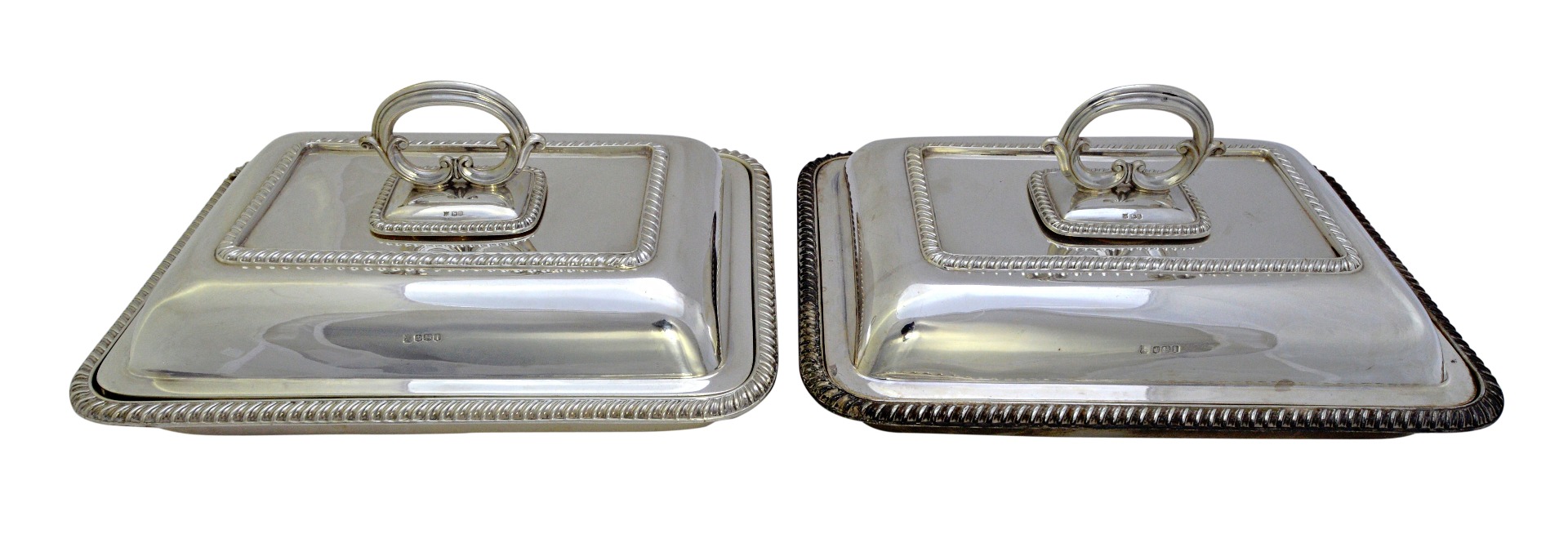 Appraisal: A pair of silver rectangular lidded entree dishes each decorated