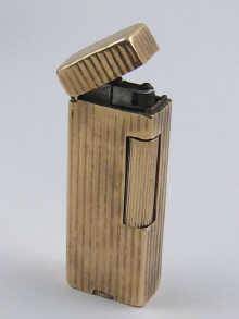 Appraisal: A carat gold cased Dunhill cigarette lighter