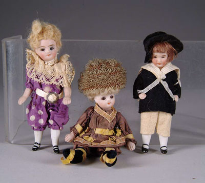 Appraisal: THREE SWIVEL NECK ALL BISQUE DOLLS Approximately - or -