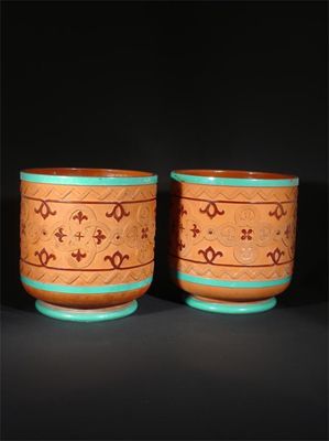 Appraisal: A pair of Watcombe Torquay terracotta jardiniere designed by Dr