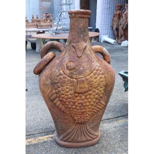 Appraisal: Large terracotta garden vase with fish motif one loop handle