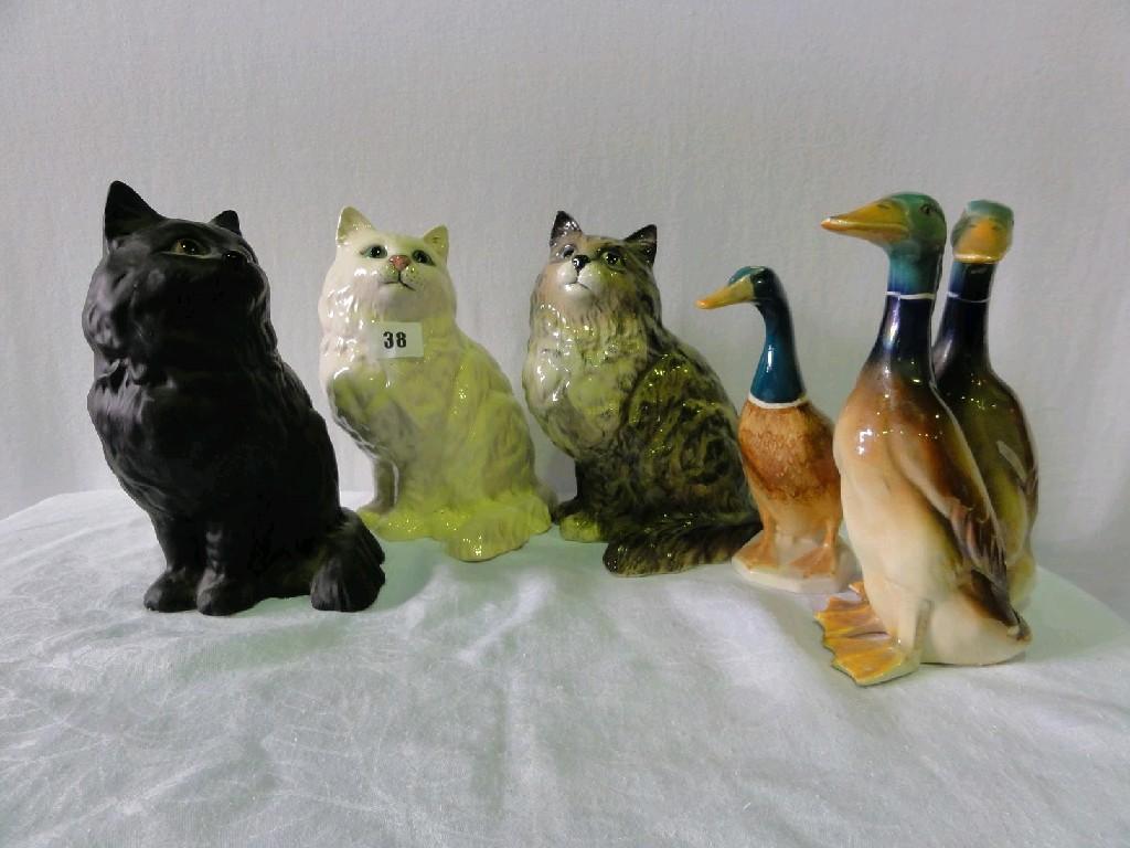 Appraisal: A collection of three Beswick models of seated long haired