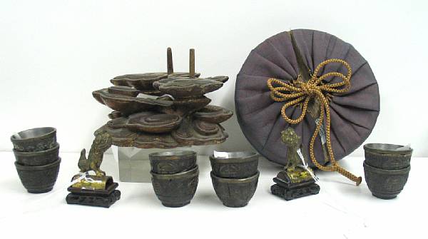 Appraisal: Fourteen assorted decorations Including ten coconut shell cups with pewter