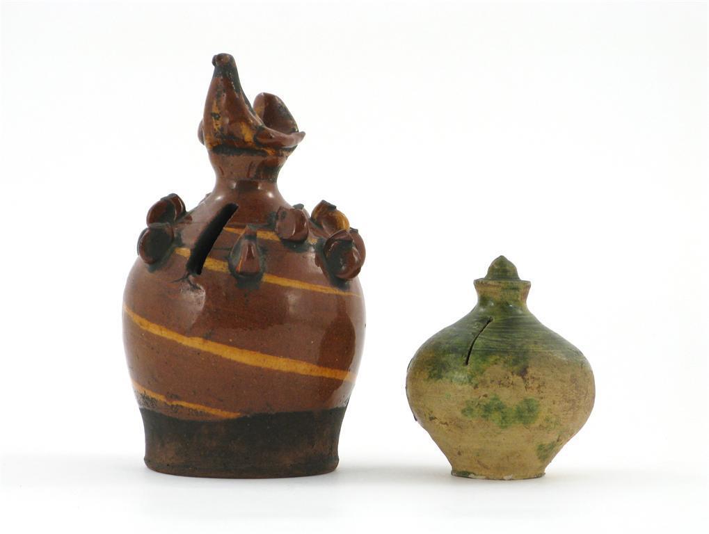 Appraisal: Two pottery moneyboxes