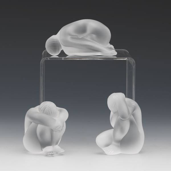 Appraisal: THREE LALIQUE GLASS NUDE FIGURINES One resting x x one