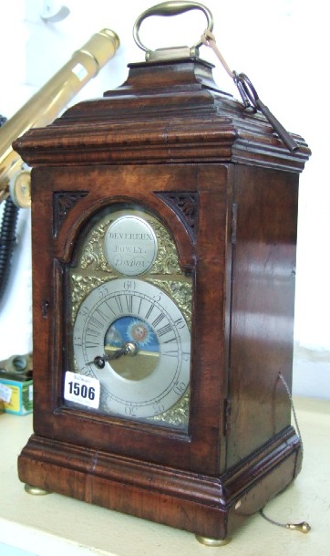 Appraisal: A walnut cased mantel clock by DEVEREUX BOWLY London four