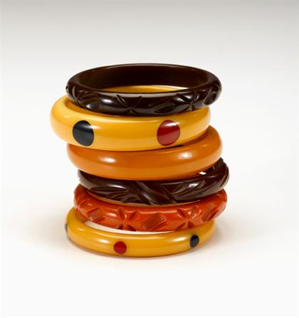 Appraisal: Group of bakelite jewelry Including several bangles and clip earrings