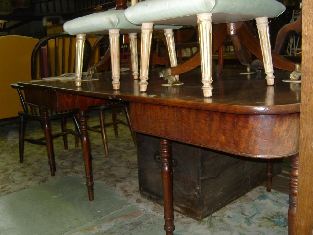 Appraisal: A Georgian mahogany -sectional extending dining table fitted with a