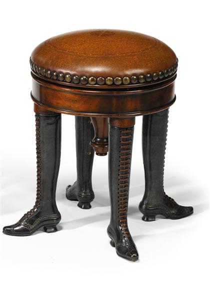 Appraisal: Mahogany bronze and leather upholstered novelty piano stool The circular