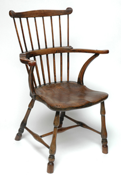 Appraisal: A PAIR OF TH CENTURY AMERICAN ELM COMB BACK ARMCHAIRS