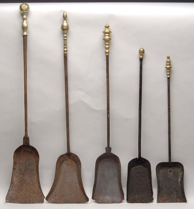 Appraisal: FIVE FIREPLACE SHOVELS All with turned brass handles First quarter