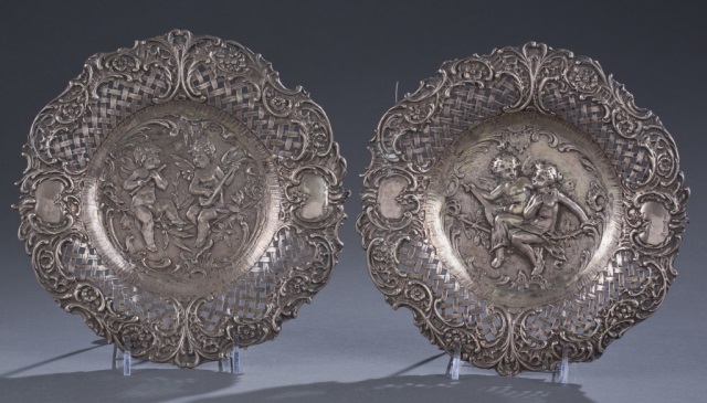 Appraisal: Two Hanau Silver Figural Plates Possibly Gerbruder Neumann Floral rim