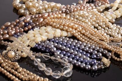 Appraisal: A pearl three-row necklace set with two Art Deco style