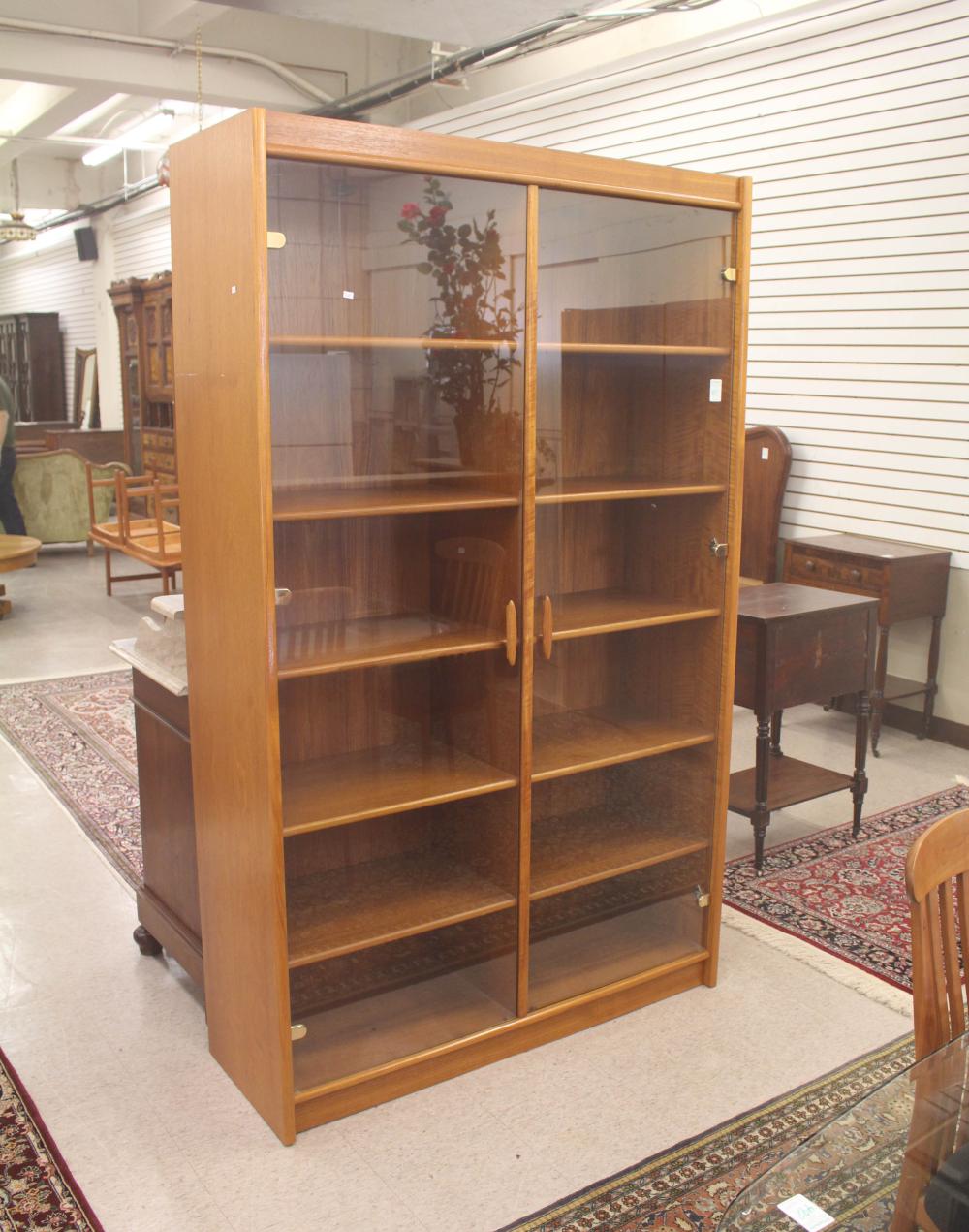 Appraisal: DANISH MODERN TEAK AND GLASS DISPLAY CABINET having ten adjustable