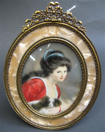 Appraisal: MINIATURE PORTRAIT OF LADY HAMILTON HOLDING HER DOG gilt metal