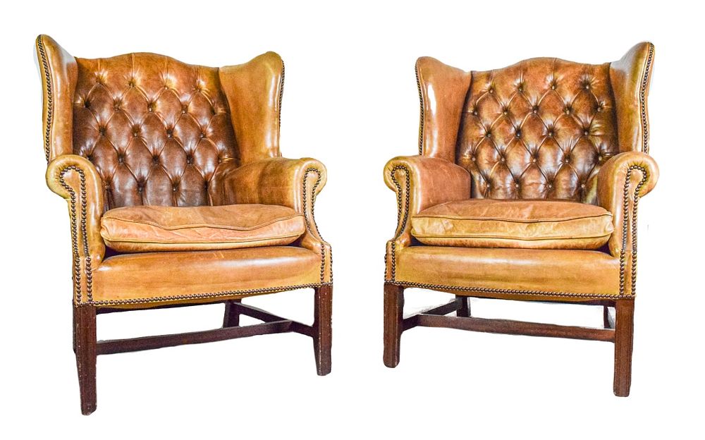 Appraisal: Pair of English Leather Wing Chairs Pair of brown leather