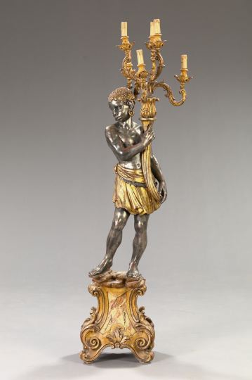 Appraisal: Tall Venetian Carved Silver-Leafed and Parcel-Gilt Wooden Six-Light Blackamoor Torchere