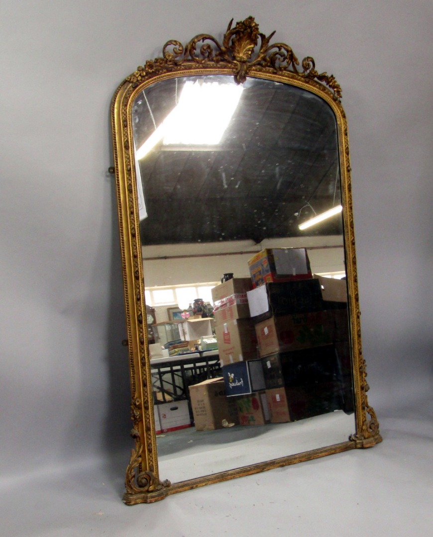 Appraisal: A Victorian gilt gesso overmantel mirror the crest decorated with