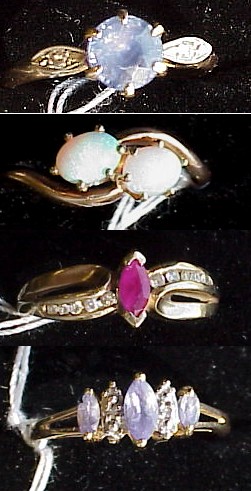 Appraisal: JEWELRY k yellow gold purple blue stone ring set with