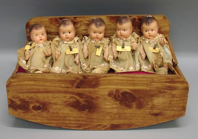 Appraisal: Set of unmarked Dionne type baby dolls in faux wooden