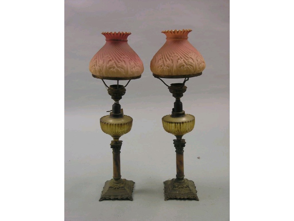 Appraisal: A pair of Victorian oil lamps alabaster stems with gilt-metal