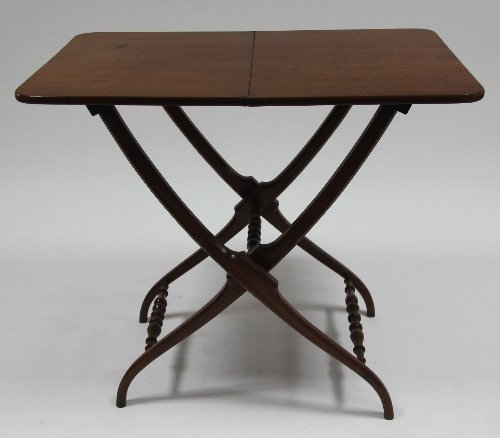 Appraisal: A mahogany coaching table on folding X frame cm wide