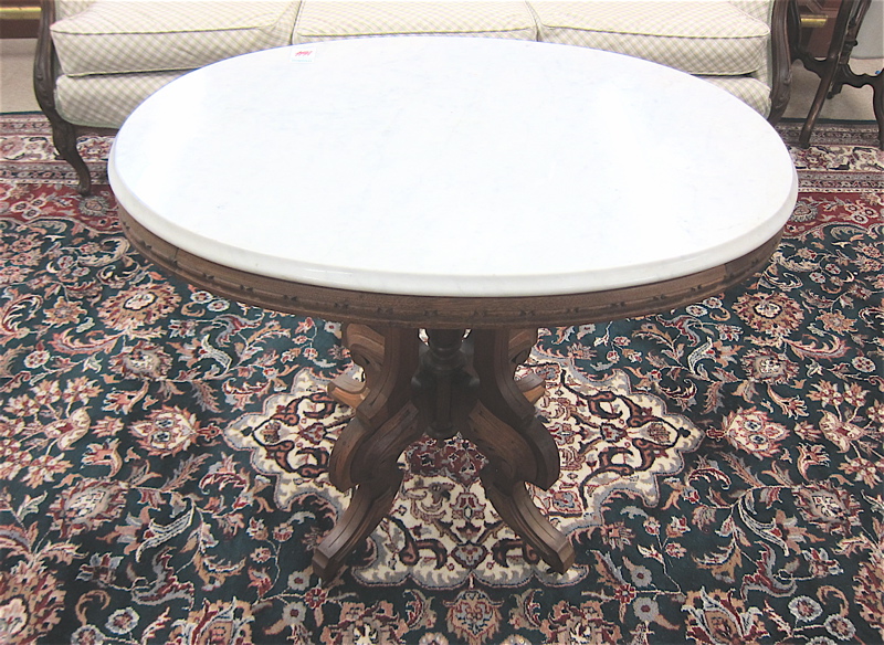 Appraisal: VICTORIAN MARBLE-TOP WALNUT LAMP TABLE Renaissance Revival style American c