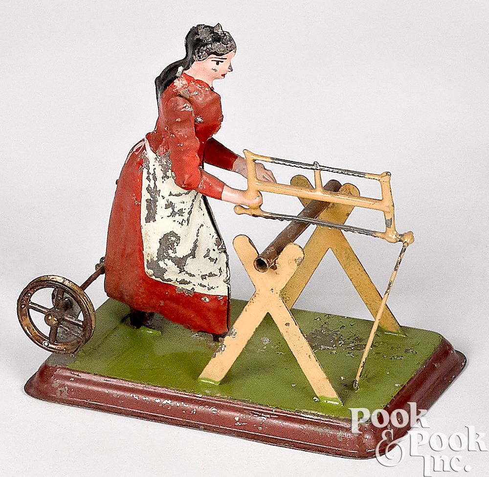 Appraisal: Becker tin woman sawyer steam toy accessory Becker painted tin