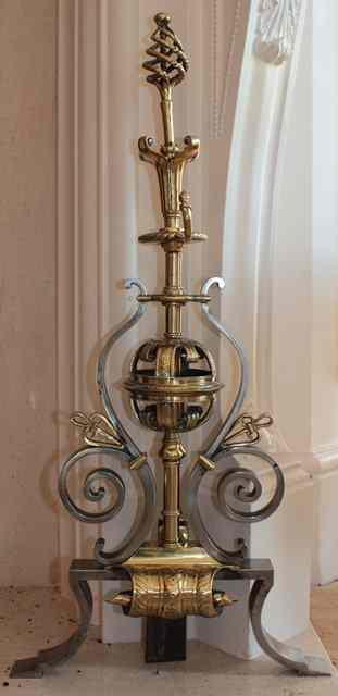 Appraisal: A PAIR OF TH CENTURY POLISHED STEEL AND BRASS FIRE