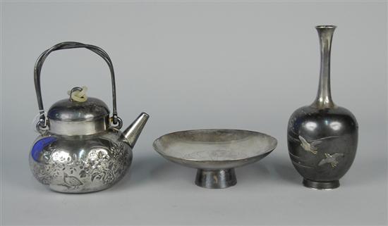 Appraisal: THREE JAPANESE SILVERED WARES including a covered teapot height inches