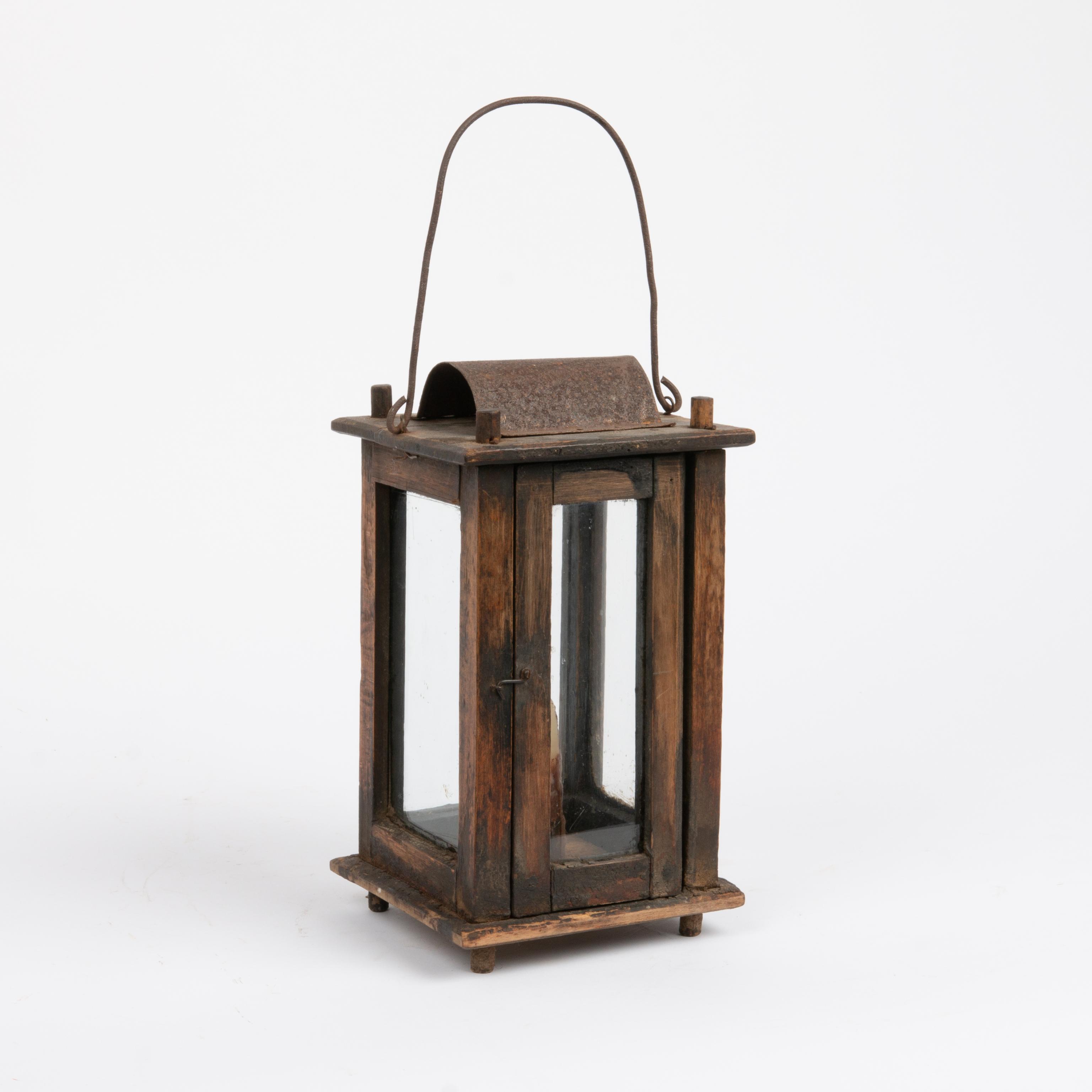 Appraisal: ANTIQUE WOODEN LANTERN A th century wooden lantern with four