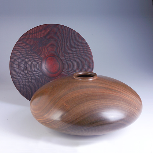 Appraisal: MERRYLL SAYLOR KUITKA Two turned wood pieces One turned charger