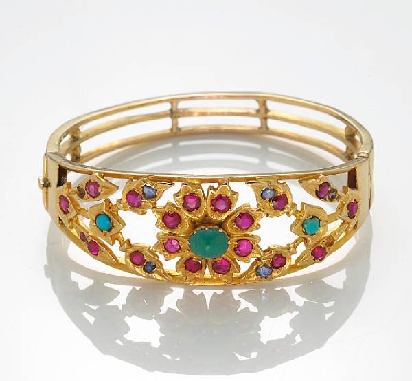 Appraisal: A turquoise colored glass and k gold bangle bracelet weighing