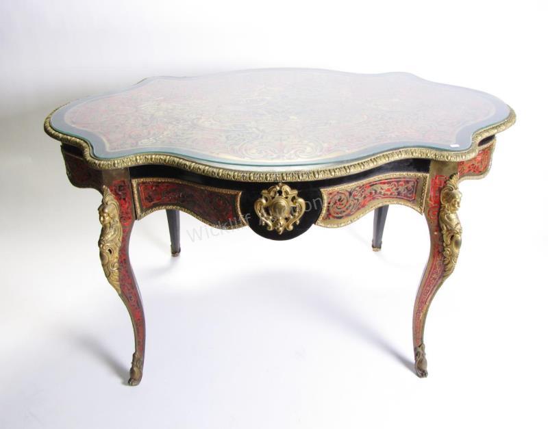 Appraisal: A Napoleon III style Boulle table with figural ormolu mounts