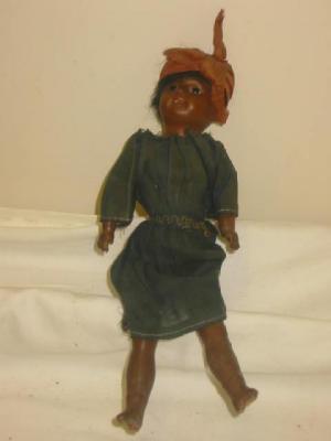 Appraisal: A German bisque head coloured girl doll with fixed brown