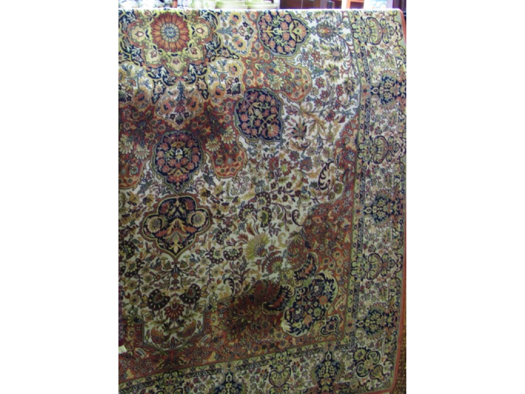 Appraisal: An extensive eastern style wool work rug the central cream