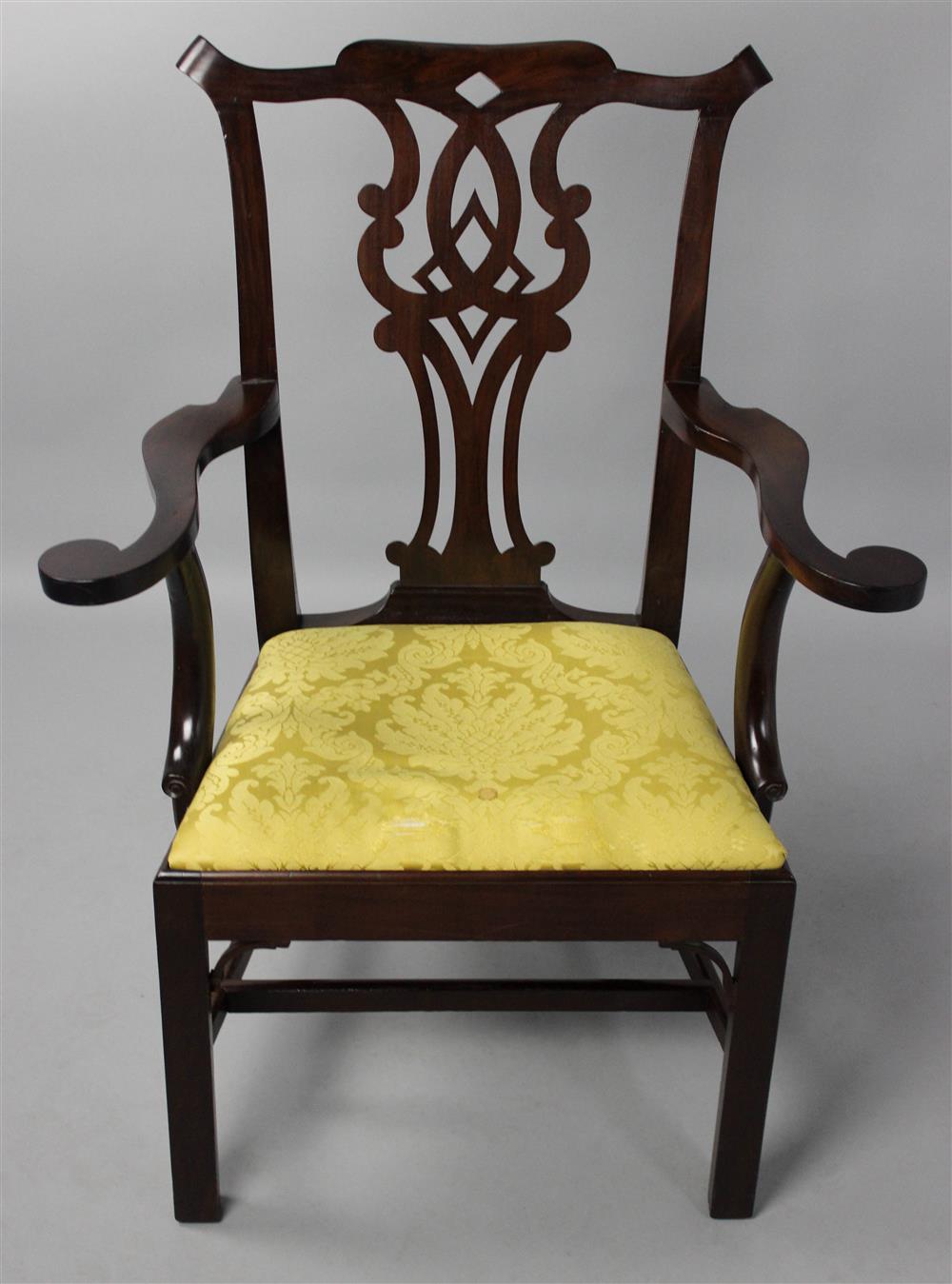 Appraisal: GEORGE III MAHOGANY ARM CHAIR the shaped pierced backscrolling crest