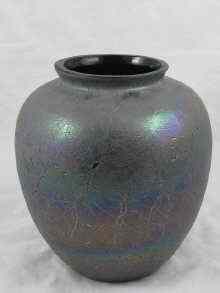 Appraisal: A large black glass vase with unusual applied glass finish