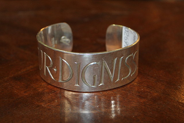 Appraisal: AN ARTS AND CRAFTS STYLE SILVER BANGLE with Latin inscription