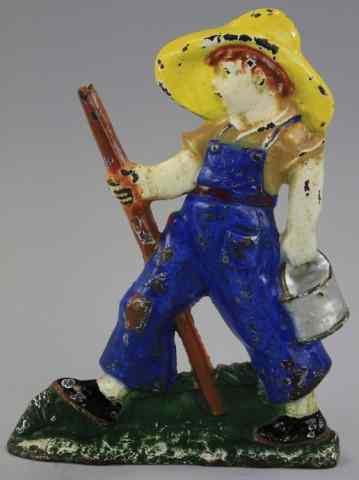 Appraisal: HUCKLEBERRY FINN DOORSTOP Littco Products storybook character great size wedge