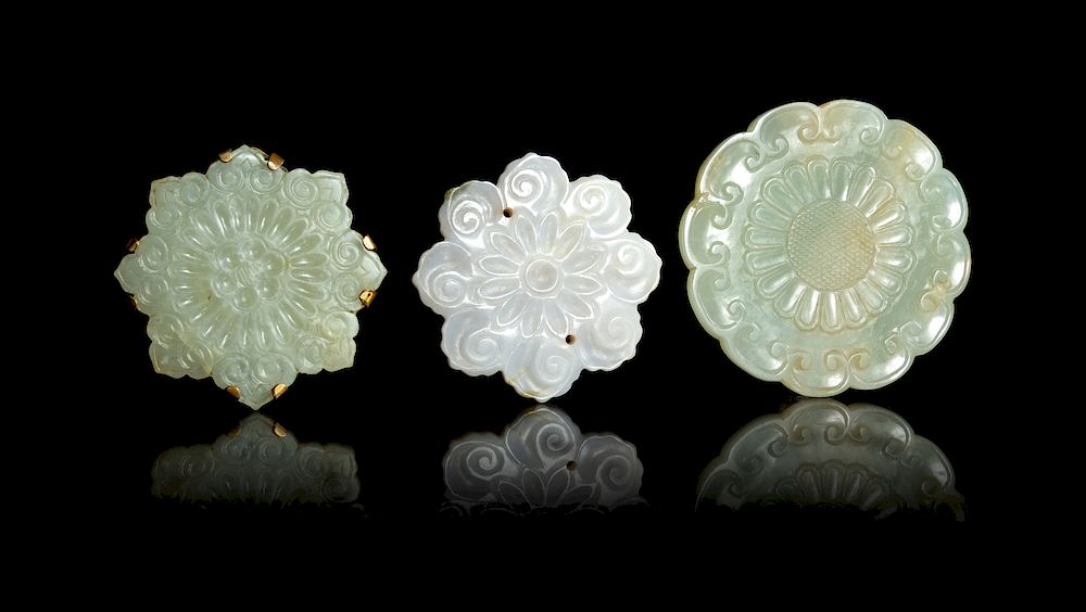 Appraisal: Three Celadon Jade Floriform Pendants Widest width in cm Three