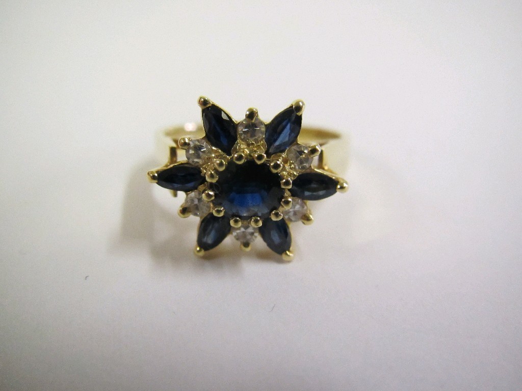 Appraisal: Eighteen carat gold sapphire and diamond flower head cluster ring