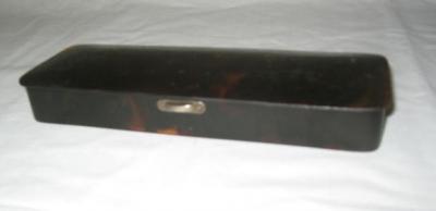 Appraisal: AN EDWARDIAN TORTOISESHELL BOX of oblong form the hinged lid