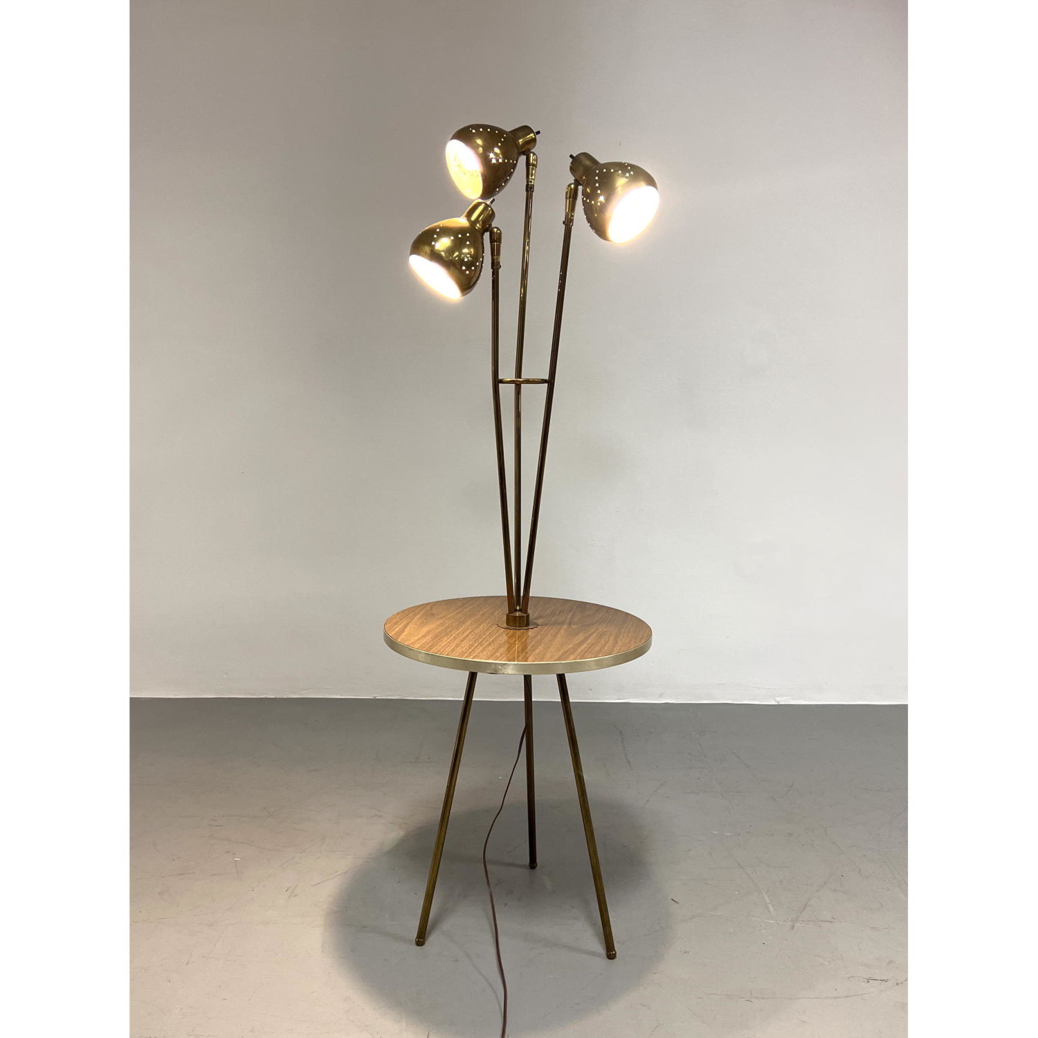 Appraisal: Mid Century Modern Tripod Lamp Table Pierced brass shades Dimensions